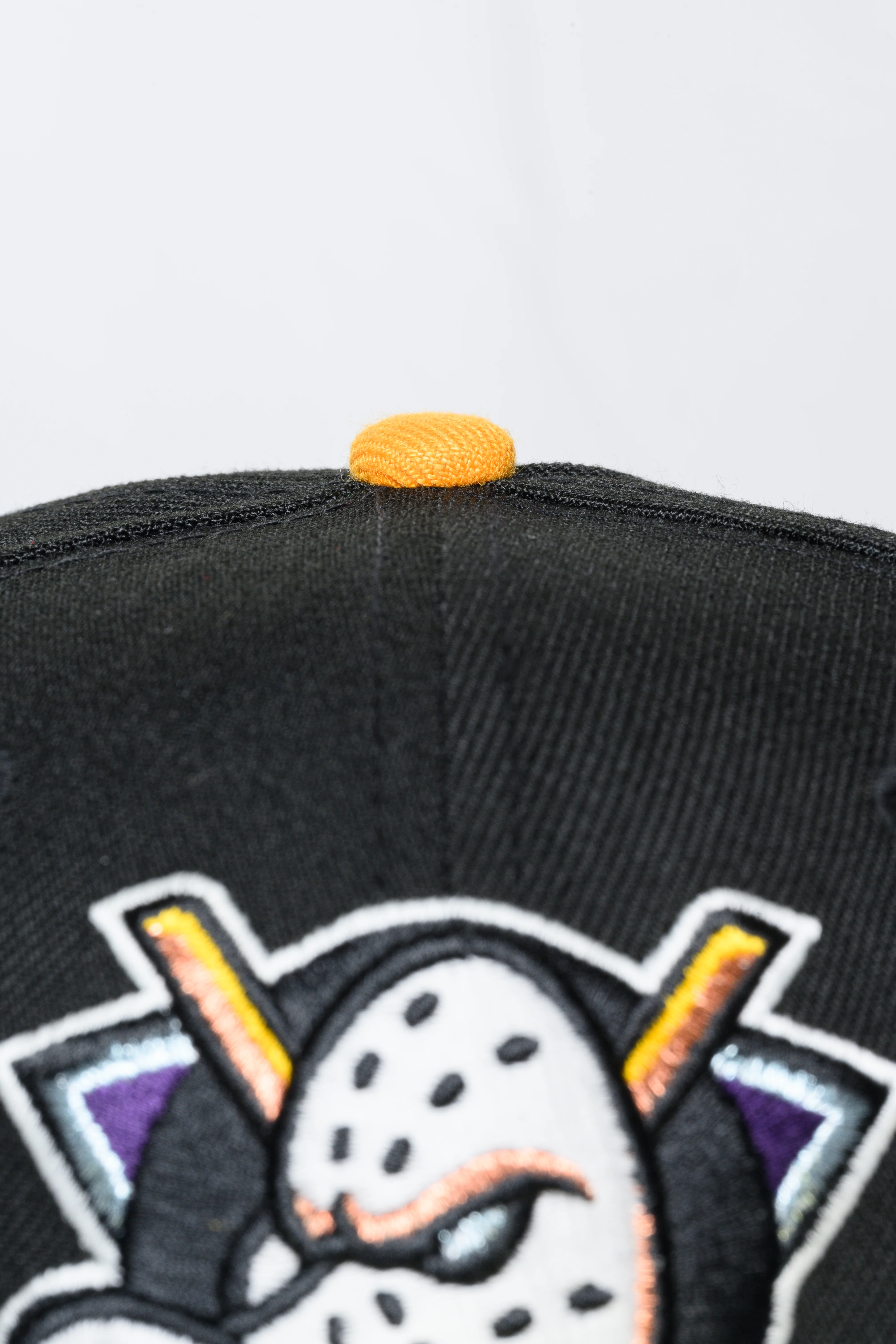 NEW ERA "DARK WIN" ANAHEIM DUCKS FITTED HAT (BLACK/PURPLE) - Image 2